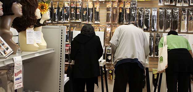 People cast their votes at the Beauty Market hair supply shop in Inglewood