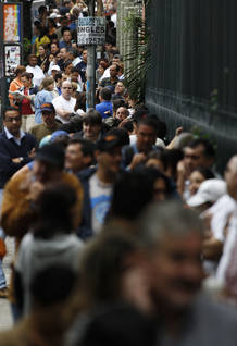 People line up to cast their votes in a polling station in Caracas People line up to cast their votes in a polling station in Caracas