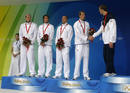Phelps of the U.S. shakes hands with Leveaux of France during the medal presentation ceremony after the mens 4x100m freestyle relay final at the Beijing 2008 Olympic Games