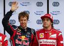 El piloto alem&aacute;n Sebastian Vettel, de Red Bull, junto al espa&ntilde;ol Fernando Alonso, de Ferrari.