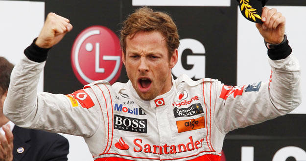 El piloto brit&aacute;nico Jenson Button celebra su victoria en el GP de Canad&aacute;.