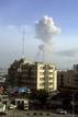 A plume of smoke rises from across the river in neighbouring Republic of Congos capital Brazzaville, as seen above the skyline of Democratic Republic of Congos capital Kinshasa