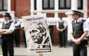 Police and protesters wait for Wikileaks founder Julian Assange to speak to the media outside the Ecuador embassy in west London