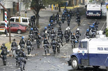 Police walk near the Brazilian embassy after the dispersal of supporters of ousted Honduras President Manuel Zelaya, in Tegucigalpa