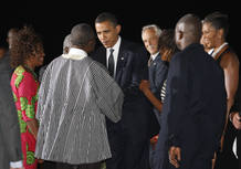 U.S. President Obama and first lady Michelle greet Ghana's President Atta Mills and his wife Ernestina upon Obama's arrival in Accra U.S. President Obama and first lady Michelle greet Ghana's President Atta Mills and his wife Ernestina upon Obama's arrival in Accra