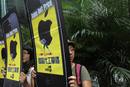 Labour activists hold cardboard cut outs resembling Apple iPhones during an 