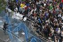 Protesters scuffle close to Spains Parliament during a demostration in Madrid