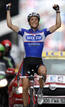 Quick Step rider Sylvain Chavanel of France celebrates as he crosses the finish line to win the second stage of the Tour de France cycling race from Brussels to Spa