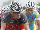 Radioshacks Lance Armstrong of the U.S and Astanas Alberto Contador of Spain ride in the rain during the second stage of the Tour de France cycling race from Brussels to Spa