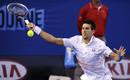 El tenista serbio Novak Djokovic en acci&oacute;n contra el espa&ntilde;ol Rafael Nadal