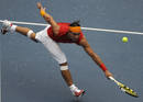 Rafael Nadal of Spain returns the ball to Potito Starace of Italy during their mens first round tennis match at the Beijing 2008 Olympic Games