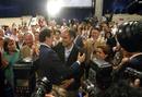 El presidente del PP, Mariano Rajoy, se abraza con el presidente de los populares valencianos Francisco Camps tras su reelecci&oacute;n como presidente del Partido Popular.