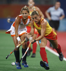 Raquel Huertas of Spain and Wieke Dijkstra of the Netherlands fight for the ball during their women's pool WA hockey match at the Beijing 2008 Olympic Games Raquel Huertas of Spain and Wieke Dijkstra of the Netherlands fight for the ball during their women's pool WA hockey match at the Beijing 2008 Olympic Games