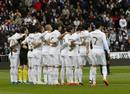 Real Madrid players hold a minute of silence for Livornos Piermario Morosini before their Spanish First Division soccer match and Sporting Gijon in Madrid