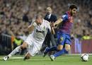 Real Madrids Pepe falls next to Barcelonas Fabregas during their Spanish Kings Cup soccer match in Madrid