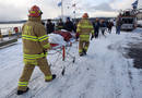 Rescue workers arrive near the scene of a U.S. Airways plane crash in the Hudson River in New York