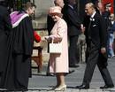 Reverend Neil Gardner greets Britains Queen Elizabeth and Prince Philip before the marriage of their eldest granddaughter Zara Phillips to Mike Tindall at Canongate Kirk in Edinburgh