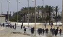 Riot police clash with anti-Mubarak protesters after a court sentenced deposed president Hosni Mubarak to life in prison, outside the police academy where the court is located in Cairo