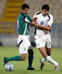 Rizk of al-Sadd club fights for the ball during Qatars Emir Cup.