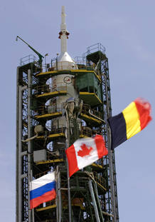 Russian, Canadian and Belgium flags are seen in front of the Soyuz TMA-15 spacecraft at Baikonur Cosmodrome Russian, Canadian and Belgium flags are seen in front of the Soyuz TMA-15 spacecraft at Baikonur Cosmodrome