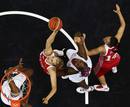 Russias Natalya Vieru and Natalya Zhedik battle for the basket against Frances Isabelle Yacoubou and Sandrine Gruda during their womens preliminary round Group B basketball match at the Basketball Arena during the London 2012 Olympic Games
