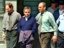 ARGENTINE PRIEST GRASSI ESCORTED UNDER ARREST.