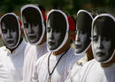 Activists wearing masks of Myanmars opposition leader Aung San Suu Kyi protest outside the Chinese embassy in Bangkok