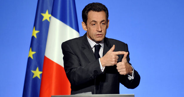 France's President Nicolas Sarkozy gestures during a speech at the Elysee Palace in Paris