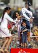 Second-placed Movistar Teams Valverde of Spain and his son Pablo is helped by attendants after the last stage of the Tour of Spain 