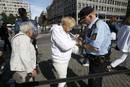 Security personnel check a womans bag on her way to a memorial service in Oslo Cathedral