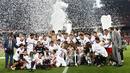 Sevillas players pose with the trophy as they celebrate after winning their Kings Cup final soccer match against Atletico Madrid at Nou Camp stadium in Barcelona