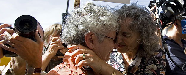Shelly Bailes and her partner Ellen Pontac hug after hearing a decision by California's Supreme Court in San Francisco