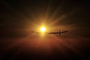 Solar Impulses CEO and pilot Andre Borschberg flies the solar-powered HB-SIA prototype plane at sunrise during its first night flight attempt near Payerne airport