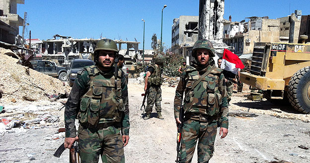 Soldados del gobierno sirio en el centro de la localidad de Al Qusair