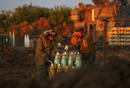 Israeli soldiers prepare artillery shells outside Gaza