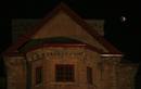 The earths shadow falls on the moon during a total lunar eclipse next to the historic Amar Mahal museum in Jammu