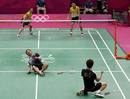 South Koreas Lee Yong-dae and Chung Jae-sung celebrate after winning their mens doubles badminton bronze medal match against Malaysia at the London 2012 Olympic Games at the Wembley Arena