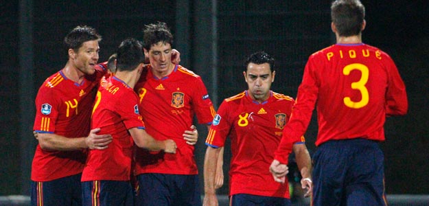 Spain players celebrate after Torres scores the first goal during their Euro 2012 qualifying soccer match against Liechtenstein in Vaduz