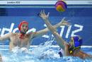 Spains goalkeeper Daniel Lopez Pinedo dives to save a shot next to Spains Blai Mallarach Guell during their mens preliminary round Group A water polo match at the Water Polo Arena during the London 2012 Olympic Games