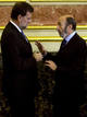 Spains Interior Minister Perez Rubalcaba talks with main opposition leader Rajoy before a ceremony in Madrid