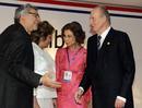 Spains King Juan Carlos and Queen Sofia are greeted by Paraguays President Fernando Lugo and first lady Mercedes Lugo as they arrive for the Latin American Summit of Paraguay in Asuncion