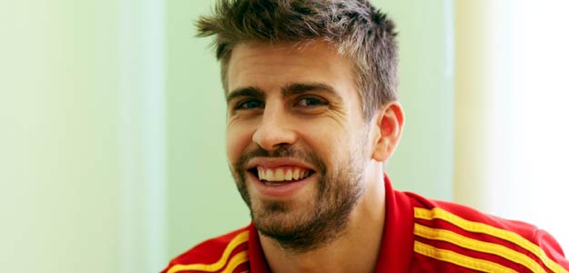 Spain's national soccer player Pique smiles during an interview with Reuters media during the Euro 2012 soccer tournament in Gniewino