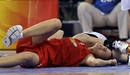 Spains Nicholls falls to the court during their womens preliminary round group B basketball game against New Zealand at the Beijing 2008 Olympic Games