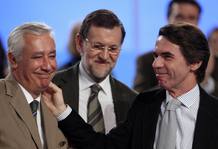 Spain's PM Mariano Rajoy, former PM Jose Maria Aznar and Andalusian People's Party (Partido Popular) President Javier Arenas smile during the national congress in Seville