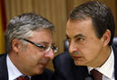 Spains Prime Minister Jose Luis Rodriguez Zapatero listens to Jose Blanco, Spanish Socialist Party (PSOE) coordinator, at the start of a meeting in Madrid