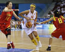 Spains Valdemoro goes to basket against Chinas Chen and Miao during womens basketball game at Beijing 2008 Olympic Games