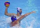Spains Xavier Valles Trias challenges Kazakhstans Alexey Panfili during their mens preliminary round Group A water polo match at the Water Polo Arena during the London 2012 Olympic Games