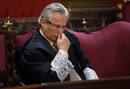 Spanish judge Baltasar Garzon sits in the dock in the Supreme Court at the start of his trial in Madrid