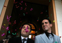 Spanish soldiers Sanchez and Linero smile after their wedding ceremony in Seville