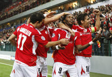 SStandard Liege's Dieudonne Mbokani celebrates after scoring against Olympiakos in Champions League soccer match in Liege